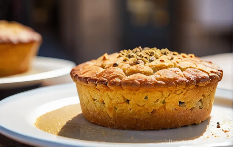 지브롤터 대표 음식 리스트 - **Prompt:** A close-up, mouth-watering shot of a freshly baked "Calentita," Gibraltar's national dis...